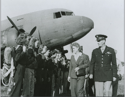 Jacqueline Cochran, Director of Women Pilots, AAF is seen here reviewing a squadron of WASP pilots at Camp Davis, North Carolina. The Women who are being reviewed are part of a target towing unit – using their aircraft to tow targets into position for live firing exercises. A hazardous task to be sure.